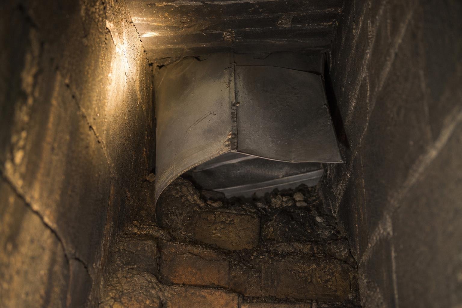 Chimney flashing and debris causing noise in the chimney