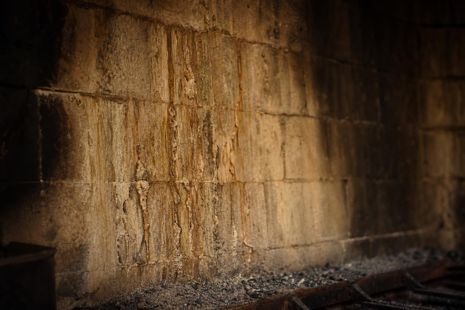 Water stains on a ceiling caused by a leaking chimney
